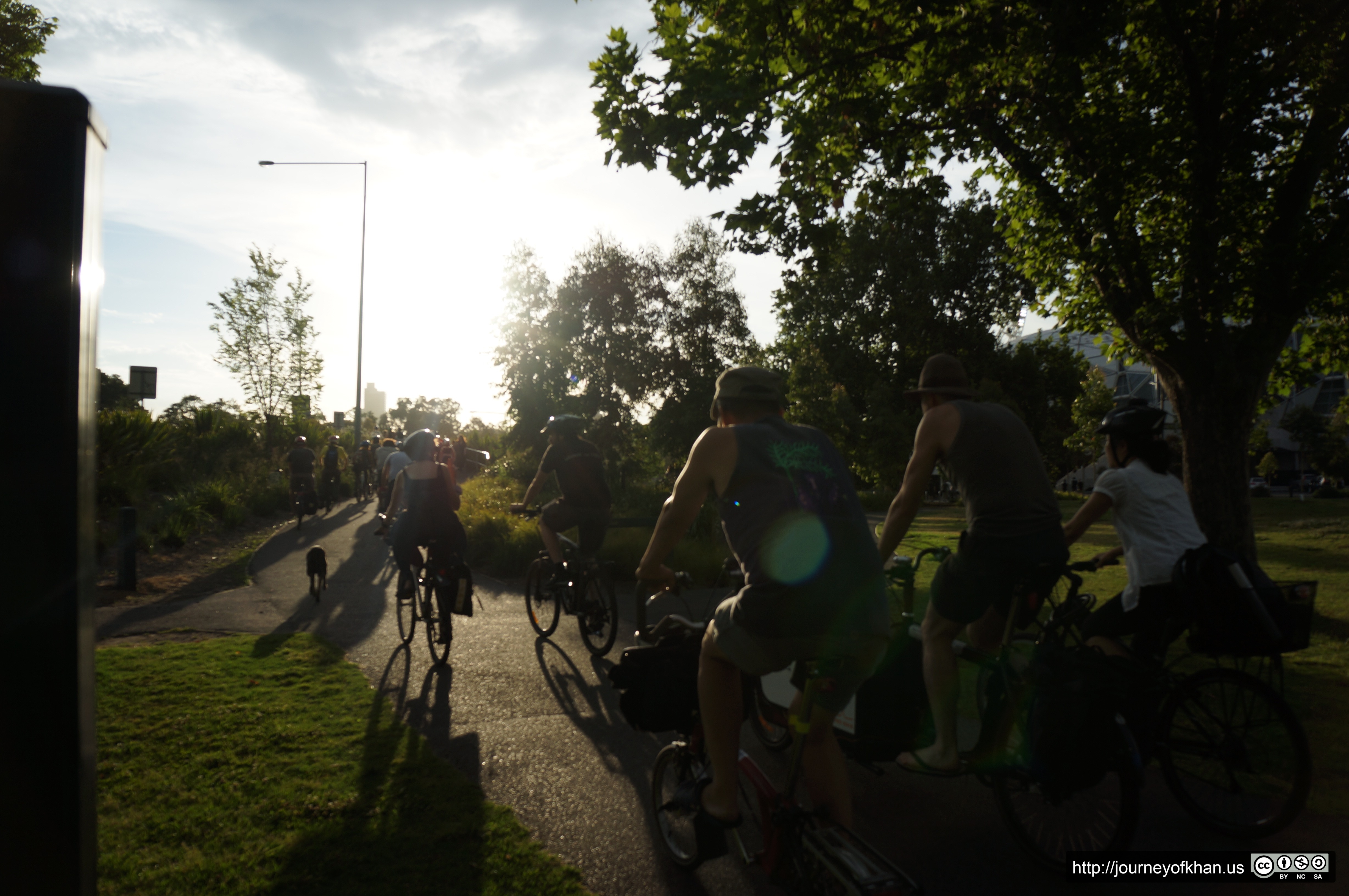 Critical Mass Melbourne Cycling through a Park (High Resolution)