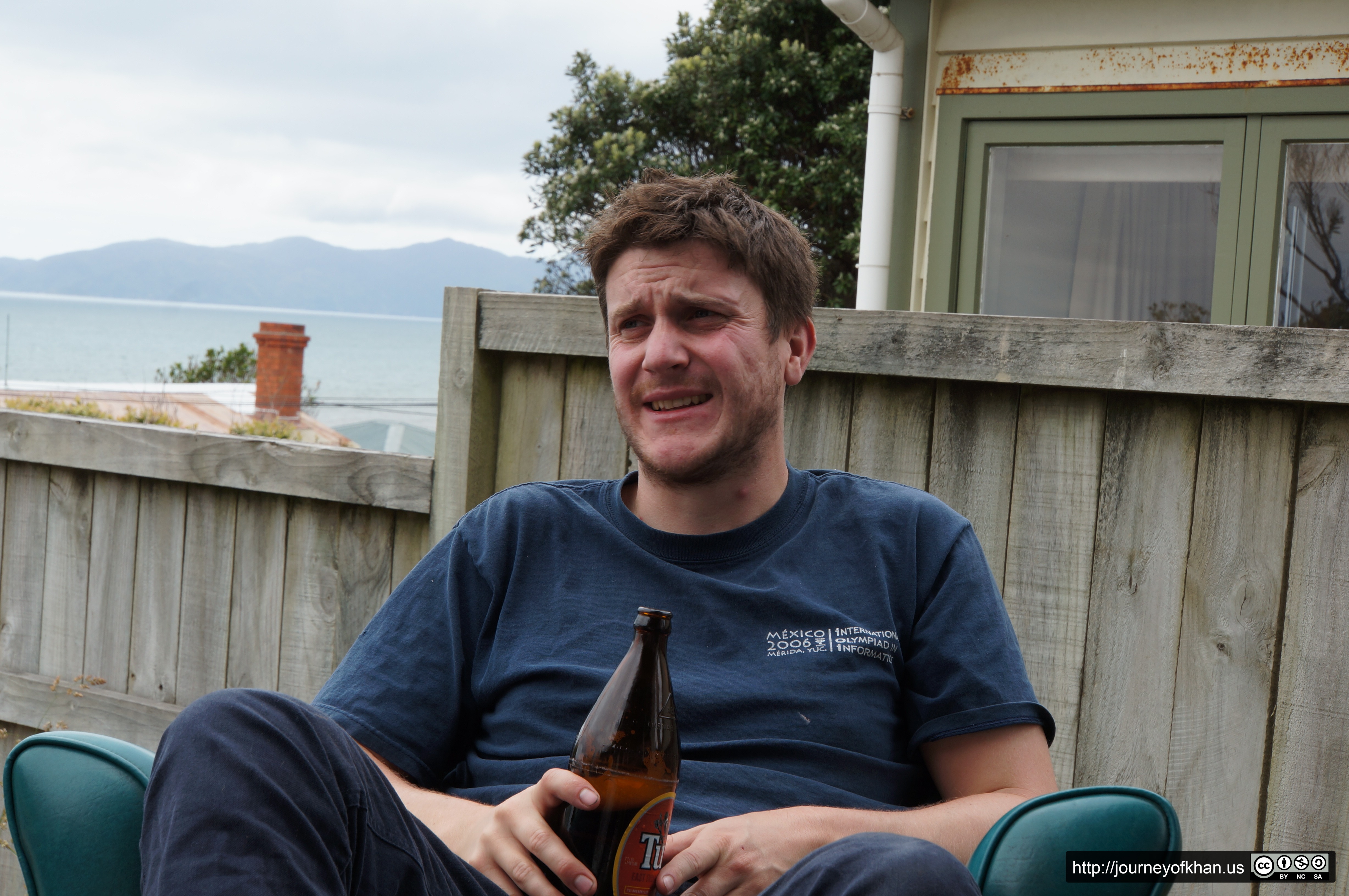 Hugh on Crate Day Drinking a Tui (High Resolution)